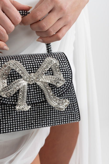 Ámbar - Clutch de Pedrería Brillante con Lazo Metálico Decorativo - Negro