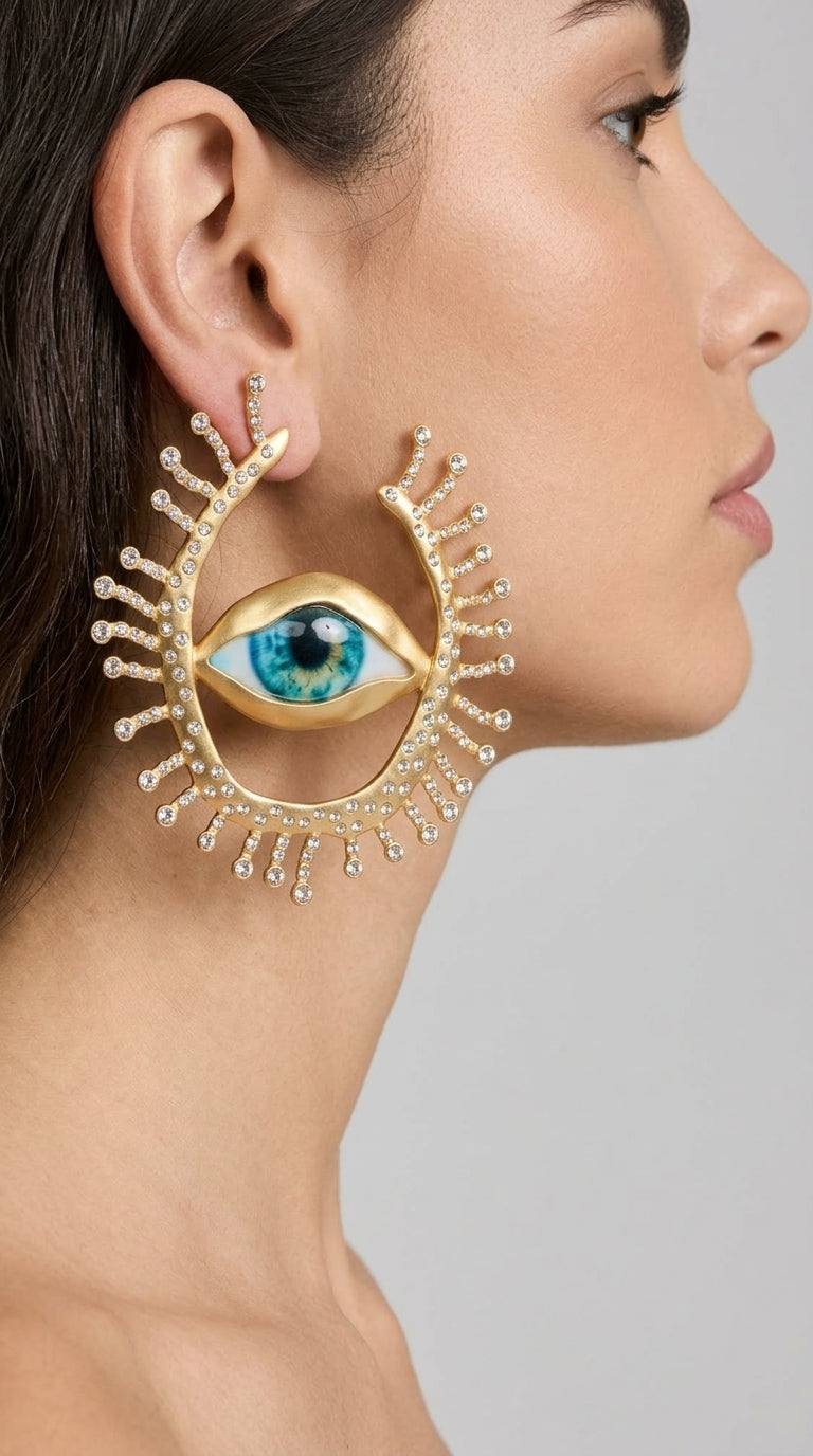 Inés - Pendientes de Ojo Llamativos con Detalles de Rayos de Cristal - Dorado